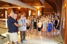 Lion President Brian with Lion Kev presenting £100 to swimming club